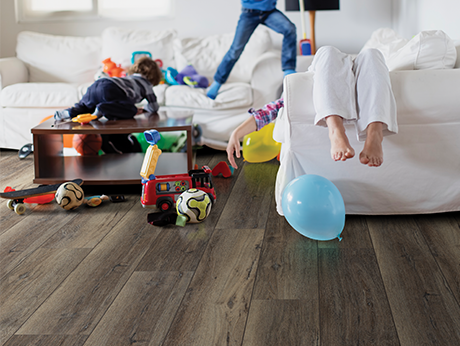 people in living room from McMillen's Carpet Outlet in Clarion